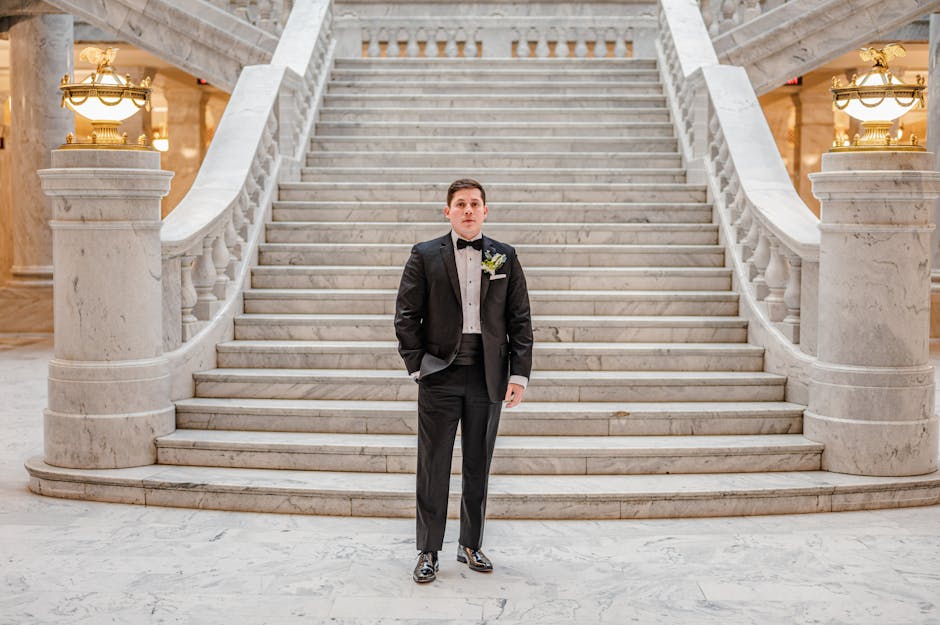 Gentleman in perfectly tailored black tuxedo with satin lapels